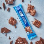 “Chocolate Sea Salt Crunch” Proteininis Batonėlis ‘Optimum Nutrition’ (55g)